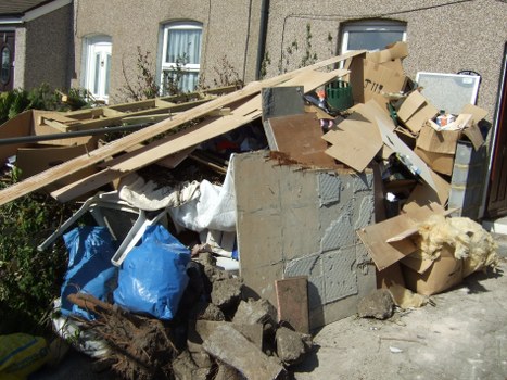 Comprehensive garden clearance services being performed